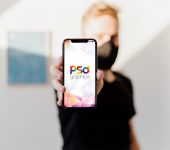 Masked Man Holding iPhone Mockup