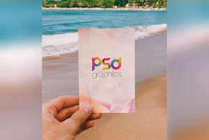 Holding Post Card in Hand Mockup PSD   
